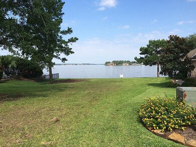 View #1 of the homes building site as seen from the street on the right side. The deep water views are incredible from this location.
