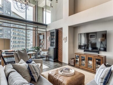 Living/dining room overlooking downtown with two s