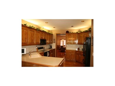 Kitchen boasts loads of cabinet and counter space,
