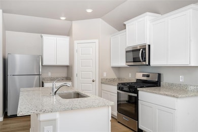 Modern elegance meets functionality! This sleek kitchen features granite countertops, stainless steel appliances, and ample cabinet space – perfect for all your culinary creations.