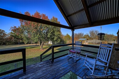 ENJOY THE COVERED PORCH AND WATCH THE CHILDREN PLA