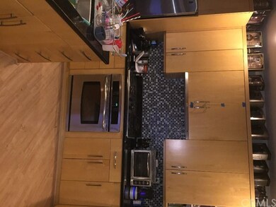 Gorgeous cabinetry with granite and tile backsplas
