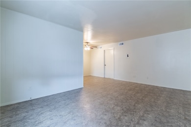 Spare room featuring tile patterned floors and a c