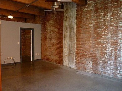 Other Angle of Master Bedroom with Exposed Brick W