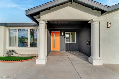 Entrance to property with stucco siding