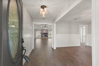 The covered front porch makes way to a charcoal-pa