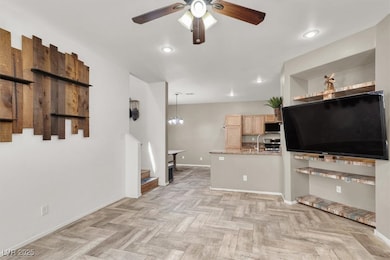 Kitchen with ceiling fan, baseboards, stainless st