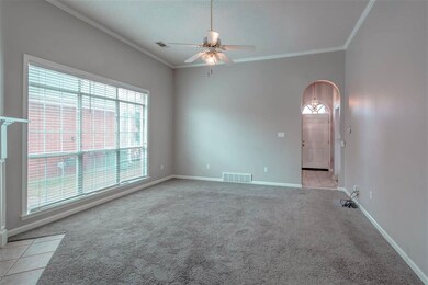 View from Kitchen to arched Entry doorway.