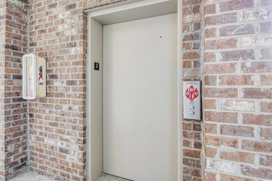 Entrance to property featuring elevator