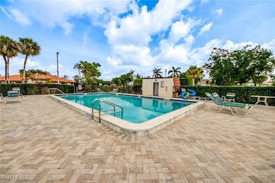 Community pool with a patio