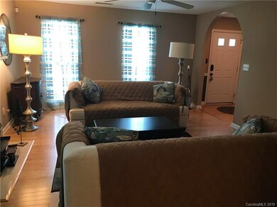 Large Living Room with New Pre-Finished Wood Flooring, Gas Fireplace and Wall-Mounted Television with Surround Sound