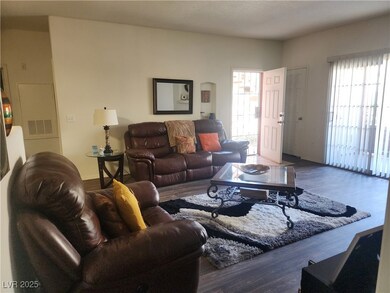 Living area featuring wood finished floors and bas