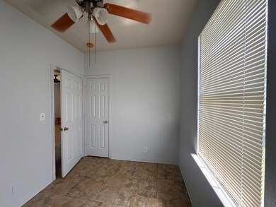 Empty room with ceiling fan, baseboards, and plen