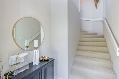 Foyer and entrance to the garage from the house (door to garage is to the right)