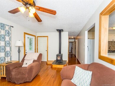 Open living room with hard wood floors.