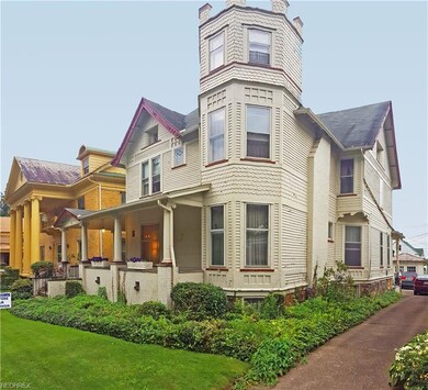 Notice the fish-scale shingles and architectural d