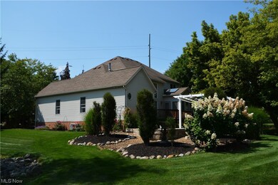 Side yard with view of gardens