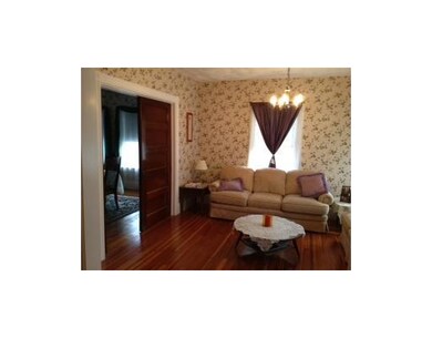 Living Room. Gorgeous wood pocket doors between fo