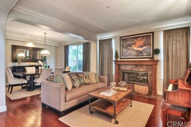 Hardwood flooring, crown molding and elegant firep