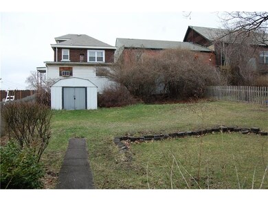 Storage shed in rear