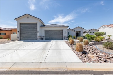 Ranch-style house featuring an attached garage, dr