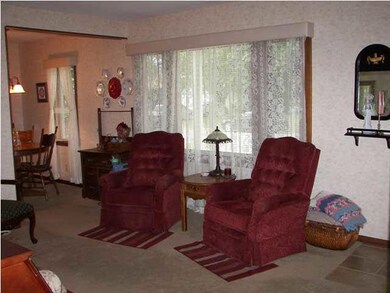 The living room is welcoming and spacious and noti