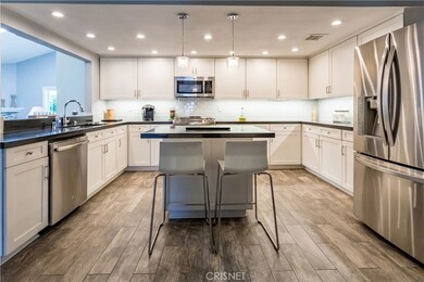 Incredible kitchen with tile flooring, quartz counters, soft close cabinets and drawers...has it all!