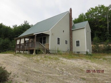The exterior offers a covered porch...