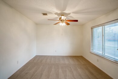 To the right of the entrance is the office w/ large window view into the front yard bringing in beautiful natural lighting. And for late evenings there is the gorgeous ceiling fan!