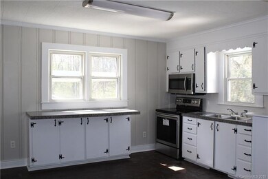 Kitchen has new counter tops, flooring, faucet and