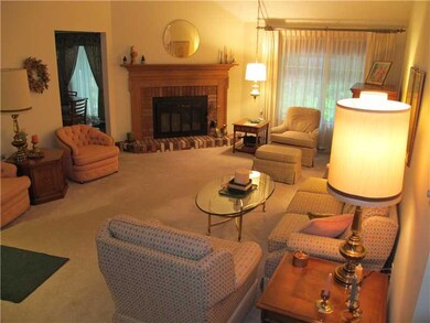 Living Room. Fireplace and wall-wall carpeting in 