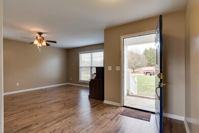 SPACIOUS LIVING ROOM AND CEILING FAN