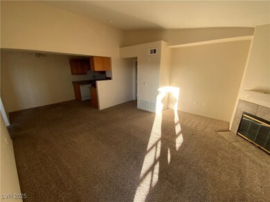 Unfurnished living room with lofted ceiling, carpe