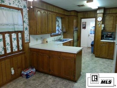 Kitchen has a double oven, range with hood, double