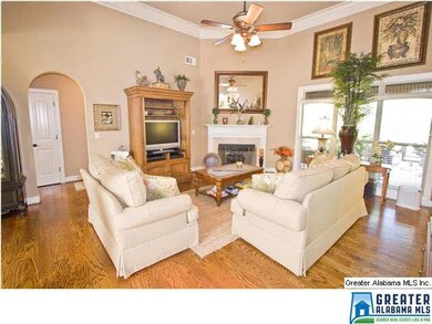 Living room has beautiful hardwood floors, high ce