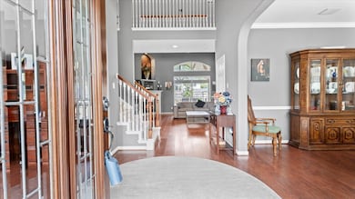 Elegant entry featuring hardwood floors and split