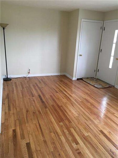 Newly stained original hardwood floors in front li
