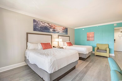 Bedroom featuring wood finished floors and crown molding