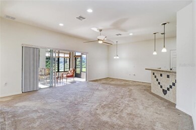 Great Room with triple sliders to sunny Lanai