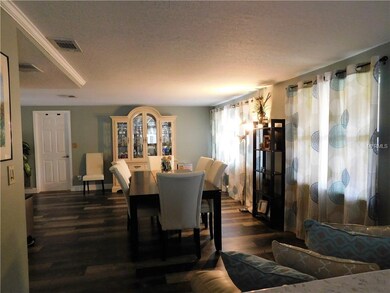 View into L-shape dining/family room from living r