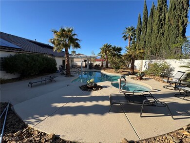 View of swimming pool with a patio area, a fenced