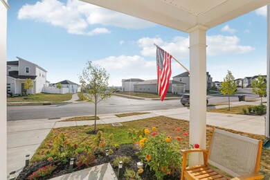 This home in immaculate condition features thoughtful landscaping for a relaxing morning cup of coffee on the front porch.