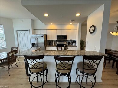 Kitchen with white cabinets, a kitchen breakfast b