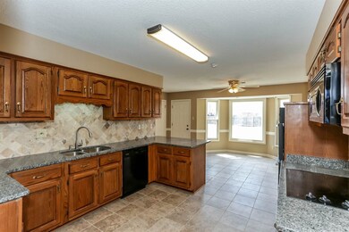 Kitchen features neutral colors, loads of counter 