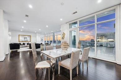 An entertainers dream, who says you cant have large gatherings when you live in a hi rise.  Enjoy the views from this open concept.  The kitchen is located just behind the dining table.