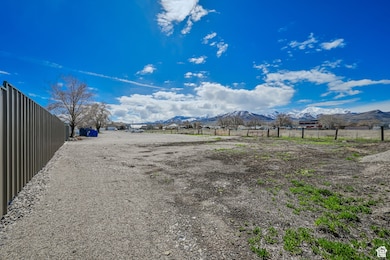 View of yard featuring a mountain view and a rural view