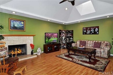 Living Room has Travertine Style Fireplace