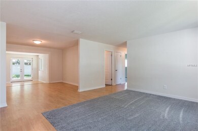View from front door to Living room, down hall to 
