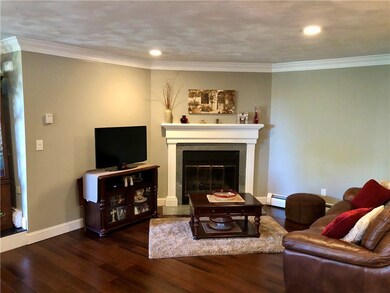 Living room has a wood-burning fireplace.