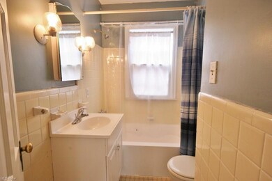 Cute Bathroom with lots of ceramic tile, easy to c